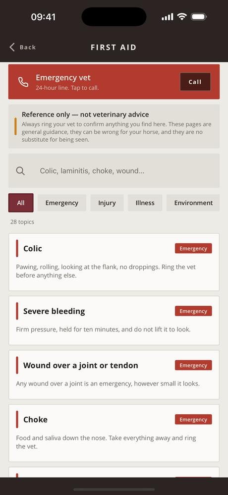 First aid library with category chips and the emergency vet button